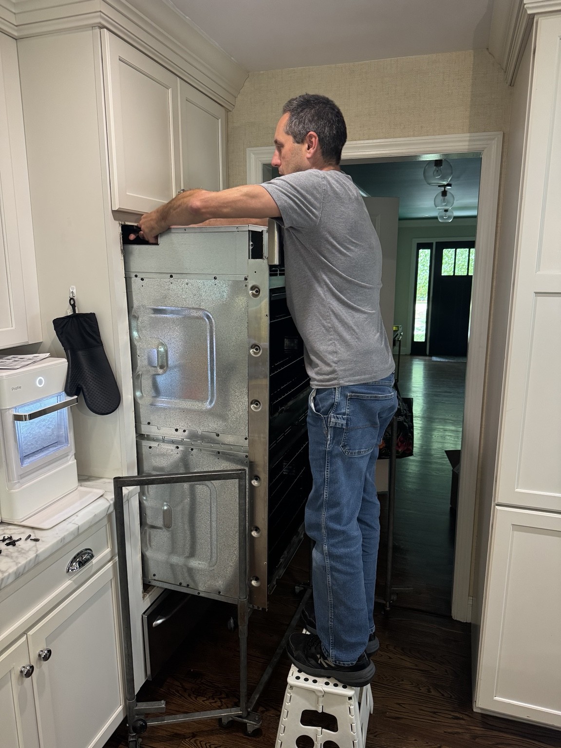 Jeff servicing a built-in wall oven